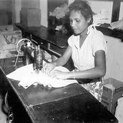 Girl sewing, 1953